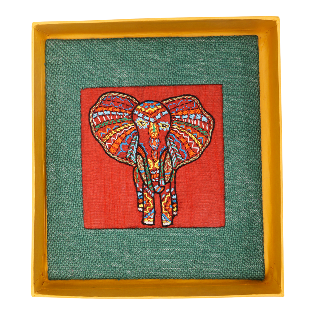 Indha Hand-Embroidered African Elephant – Silk Textile Art with Mini Wooden Easel A vibrant elephant motif stitched on rich silk—tabletop ready, gift-ready